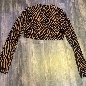 Size M zebra striped long sleeve crop top.